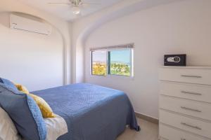 Postel nebo postele na pokoji v ubytování MariaMar Suites