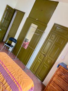 Ένα ή περισσότερα κρεβάτια σε δωμάτιο στο Hostal Santuario de las Libelulas