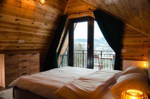 En eller flere senger på et rom på Zenit Chalet Sohodol-Bran