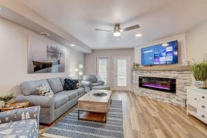 a living room with a couch and a fireplace at Lakefront Luxury for Families or Couples in Wisconsin Dells
