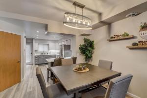 a dining room and kitchen with a table and chairs at Lakefront Luxury for Families or Couples in Wisconsin Dells