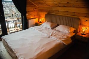 En eller flere senger på et rom på Zenit Chalet Sohodol-Bran
