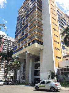 a car parked in front of a building at GARVEY PARK HOTEL in Brasília
