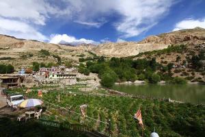 a view of a valley with a lake and mountains at Hotel Lake view in Nako