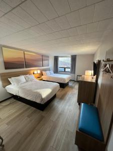 Postel nebo postele na pokoji v ubytování Days Inn by Wyndham Liberty