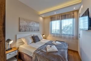 Postel nebo postele na pokoji v ubytování Exclusive Centar Peković