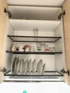 a kitchen shelf with a bunch of knives on it at Ade 1 in Oulu