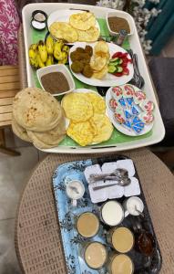 a tray of food with breakfast foods on it at New Abdeen palace hostel in Cairo