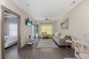 a living room with a couch and a bed at Uptown, Pool, Wine, Restaurants, BofA Stadium_307 in Charlotte +33 photos