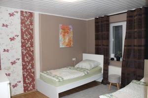 a small bedroom with a bed and a window at 3 Zimmer 6 Betten Renoviert in Koblenz