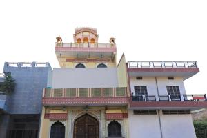 a building with a billboard on top of it at Flagship Hotel Baba Haveli in Jaipur