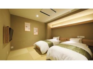 Una cama o camas en una habitación de Ryokan Biyu no Yado - Vacation STAY 16235v