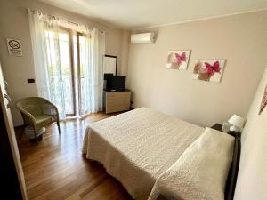Postel nebo postele na pokoji v ubytování B&B Mariposa