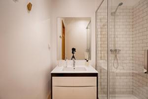 a bathroom with a sink and a shower at Master Historical Gem in Chiado in Lisbon