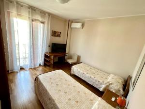 Postel nebo postele na pokoji v ubytování B&B Mariposa