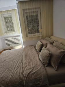 מיטה או מיטות בחדר ב-Rooftop apartment
