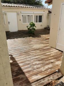 a wooden deck in front of a house at Calanques Prado Stade et Parking in Marseille