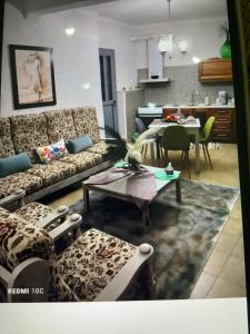 a living room with a couch and a table at MATEO in Livadeia