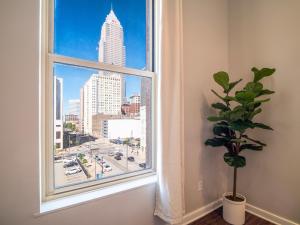 a window with a view of a city at Downtown Condo in Cleveland