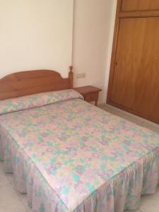 Posteľ alebo postele v izbe v ubytovaní Apartamentos Vicent