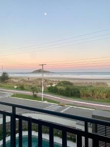 a view of the beach from a balcony at Apto Pé na Areia com Piscina Privativa in Imbituba