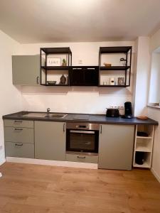 a kitchen with a sink and a counter top at Große Apartments für Monteure - Dorsten - in Dorsten