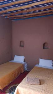 A bed or beds in a room at Dar Yaya