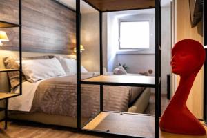 Ένα ή περισσότερα κρεβάτια σε δωμάτιο στο La Casa dello Stilista