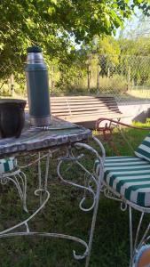 a picnic table with a barrel on top of it at La Mora Home - Casa de Campo in Victoria