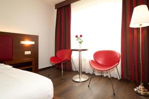 Letto o letti in una camera di Hotel Conti Dietikon