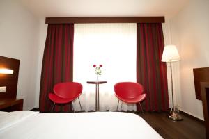 Letto o letti in una camera di Hotel Conti Dietikon