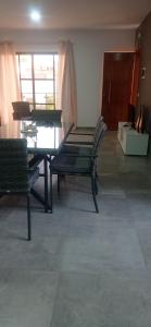 a dining room with a glass table and chairs at Apartments A&A - Santa Maria in Santa Maria