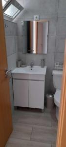 a bathroom with a sink and a toilet at Apartments A&A - Santa Maria in Santa Maria