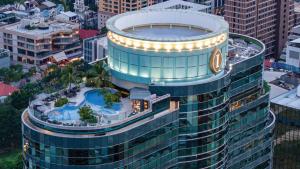 an aerial view of a large building with a pool at InterContinental Bangkok by IHG in Bangkok