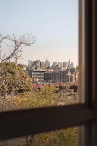 a view of a city from a window at MAC South Yarra by Melbourne Apartment Collection in Melbourne