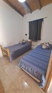 Una cama o camas en una habitación de Alojamiento San Rafael 3