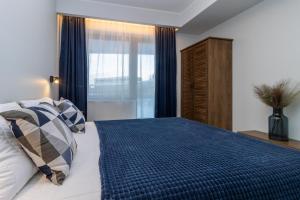 Ένα ή περισσότερα κρεβάτια σε δωμάτιο στο Cozy apartment by the Baltic Sea