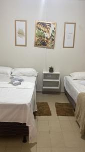 Giường trong phòng chung tại Casa na Praia Maragogi