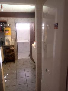 a bathroom with a shower and a sink and a toilet at Hostel Porto Vip in Porto De Galinhas