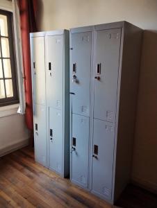 three lockers are lined up in a room at Wild Bellavista Hostel in Santiago