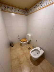 a bathroom with a toilet and a bidet at Casa del Valle in Ushuaia