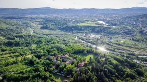 an aerial view of a valley with trees and a river at Casa de pe rau in Telega