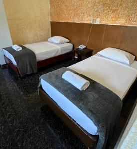 Un pat sau paturi într-o cameră la HOTEL BLUE COSTA Panama