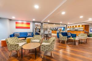 a lobby with a couch and tables and chairs at Holiday Inn Express Ramsgate – Minster by IHG in Minster