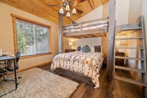 a bedroom with a bunk bed and a desk at Big Bear Family Chateau, Hot Tub, Pool Table, Ev in Big Bear Lake