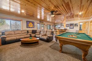 a living room with a pool table and a ceiling at Big Bear Family Chateau, Hot Tub, Pool Table, Ev in Big Bear Lake