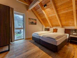 Posteľ alebo postele v izbe v ubytovaní Mountain Chalet Chapeau