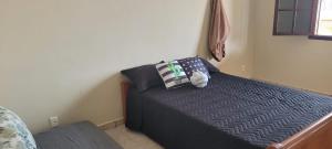 Katil atau katil-katil dalam bilik di Recanto do mar e da lagoa