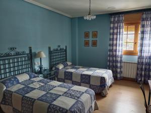 Rúm í herbergi á Hotel Pico Espiguete
