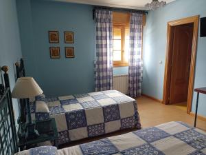 Rúm í herbergi á Hotel Pico Espiguete